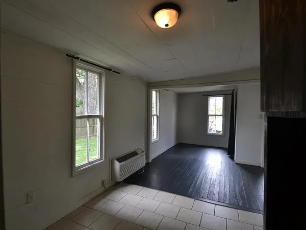 a view of a livingroom with wooden floor