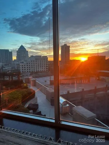 a view of a glass door with a floor to ceiling window
