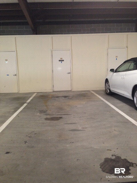 28250 Canal Road, Unit 906 Orange Beach, AL 36561 - Photo 23 of 43 Detached parking garage with storage room