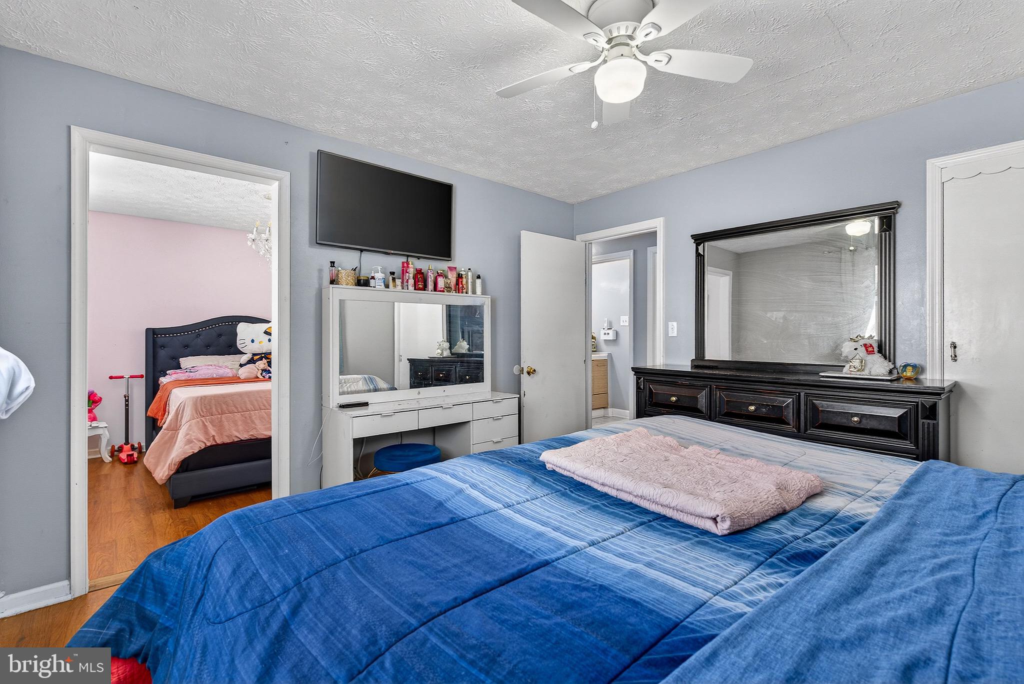 3505 East Joppa Road Parkville, MD 21234 - Photo 15 of 42 a bedroom with a bed and a flat screen tv