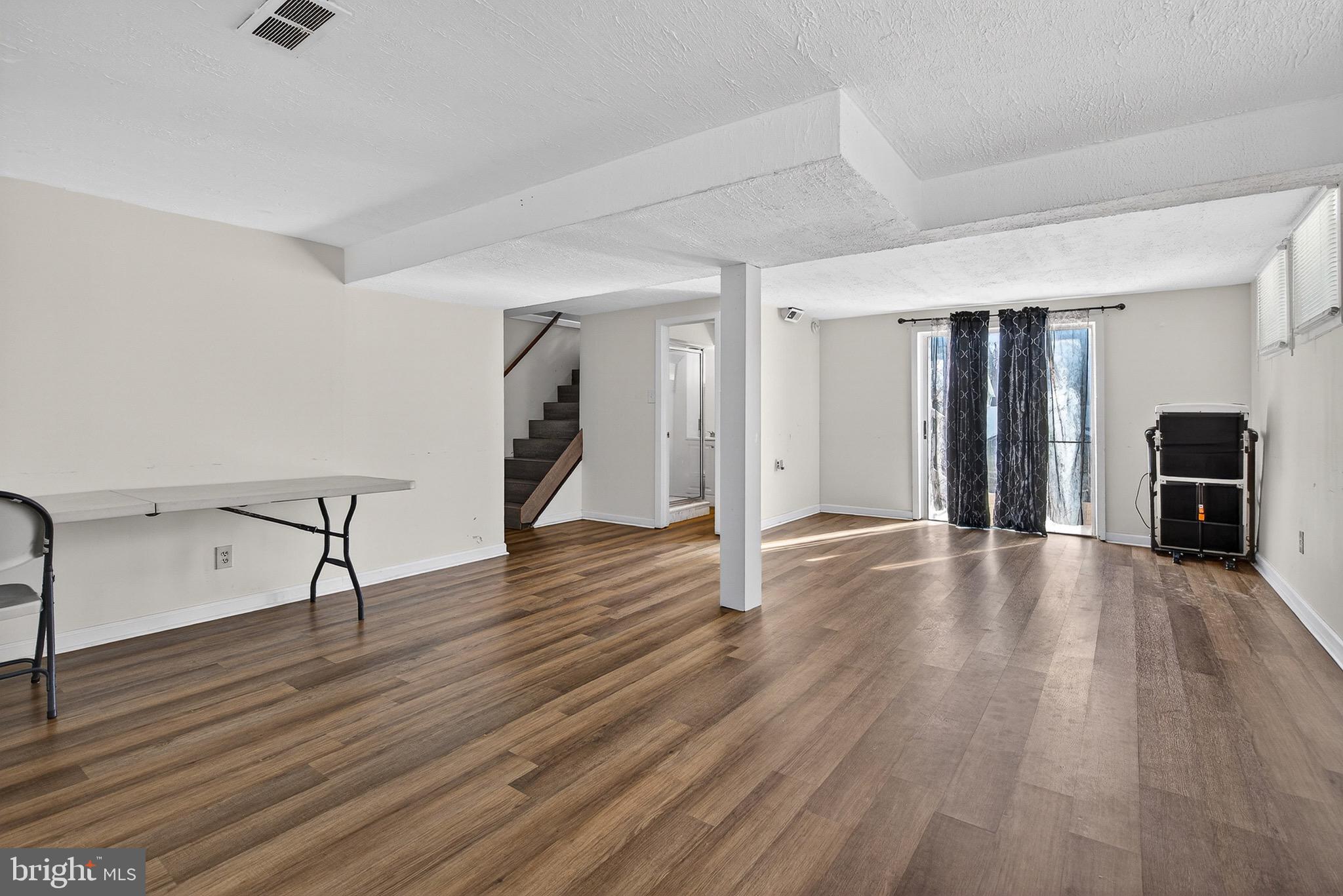 3505 East Joppa Road Parkville, MD 21234 - Photo 19 of 42 a view of a livingroom with wooden floor and furniture