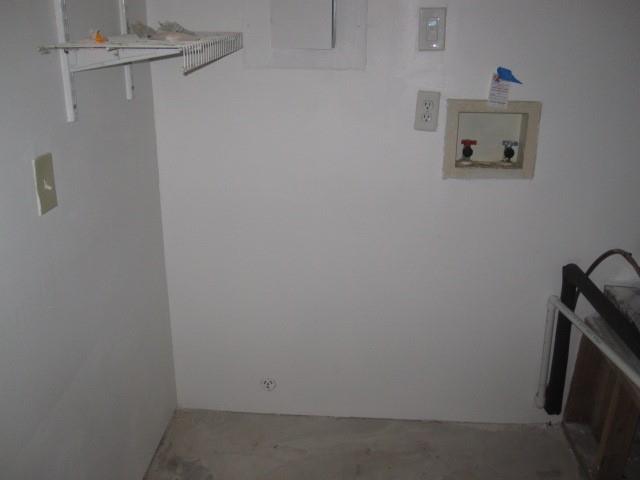 2150 Harris Street Gainesville, TX 76240 - Photo 14 of 20 a view of storage and utility room with a fireplace