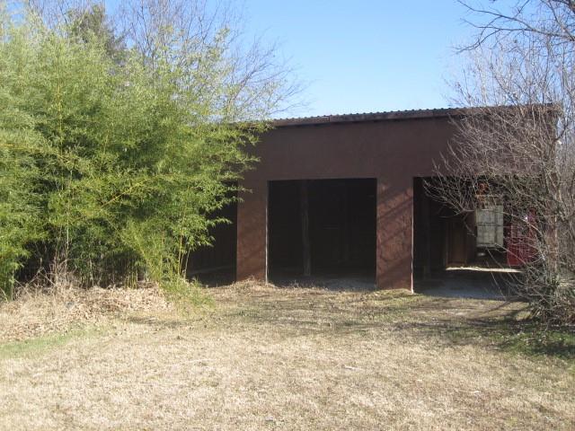 2150 Harris Street Gainesville, TX 76240 - Photo 18 of 20 a house with trees in the background