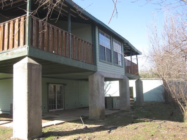 2150 Harris Street Gainesville, TX 76240 - Photo 20 of 20 a view of a house with a yard