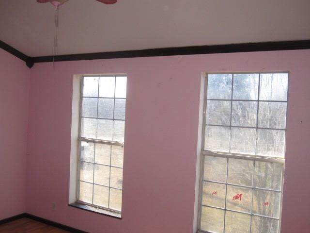 2150 Harris Street Gainesville, TX 76240 - Photo 8 of 20 an empty room with windows