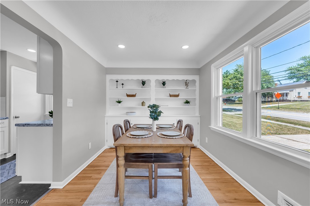 4322 Roadoan Road Brooklyn, OH 44144 - Photo 11 of 27 Dining room with light hardwood / wood-style floors and built in shelves