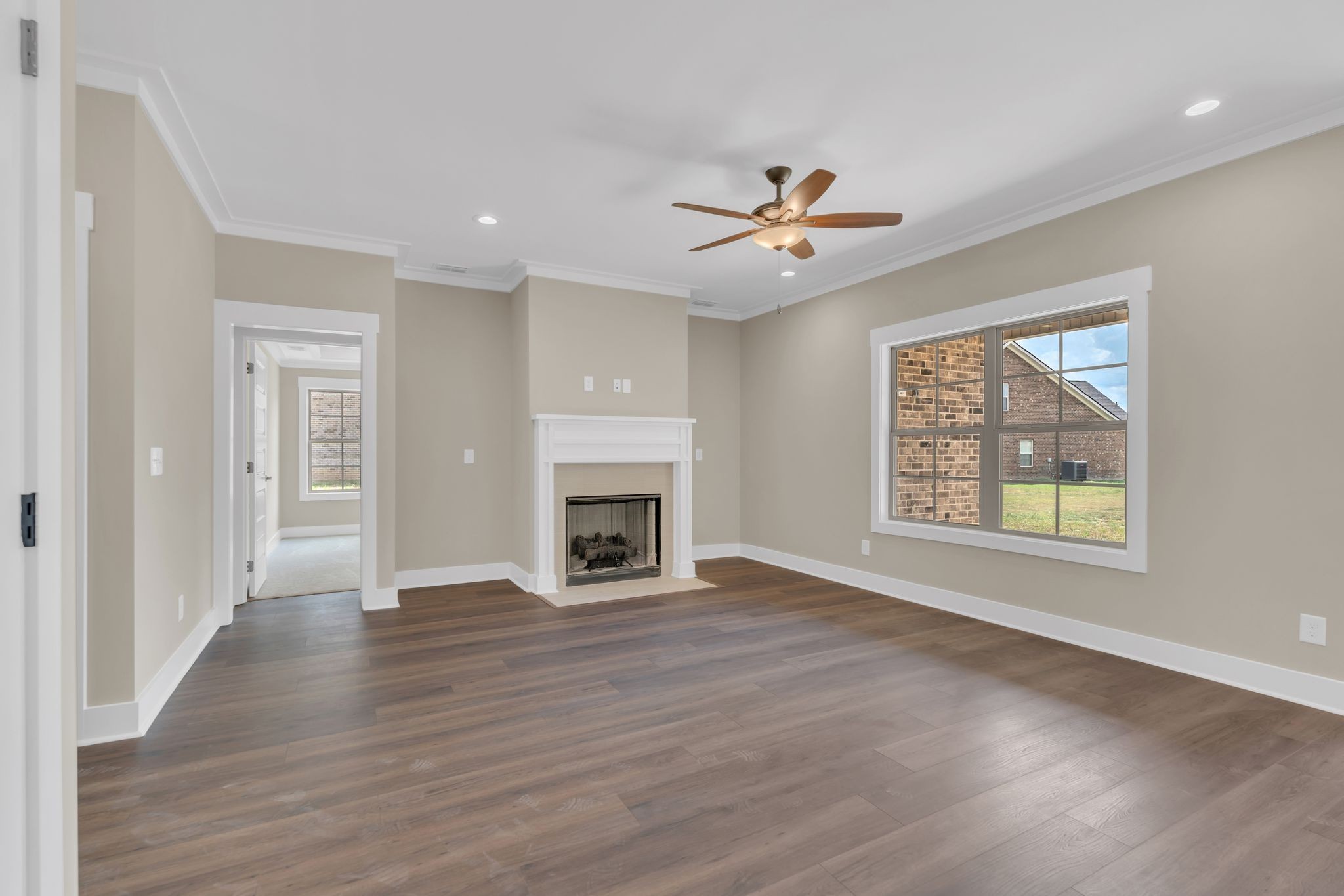 1170 Rimrock Road Smyrna, TN 37167 - Photo 7 of 33 a view of an empty room with a window and wooden floor