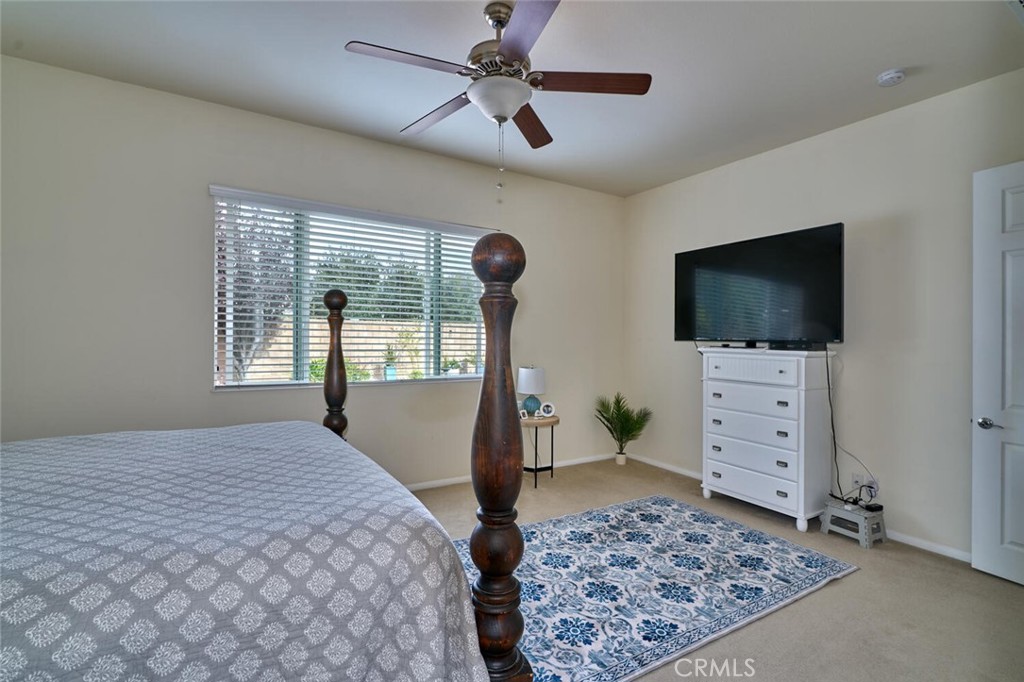 860 Annandale Road Beaumont, CA 92223 - Photo 25 of 61 a bedroom with furniture and a flat screen tv