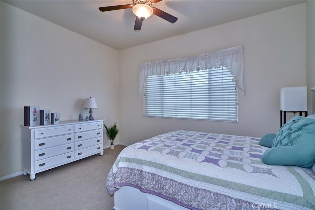 860 Annandale Road Beaumont, CA 92223 - Photo 34 of 61 a bedroom with a bed and a dresser