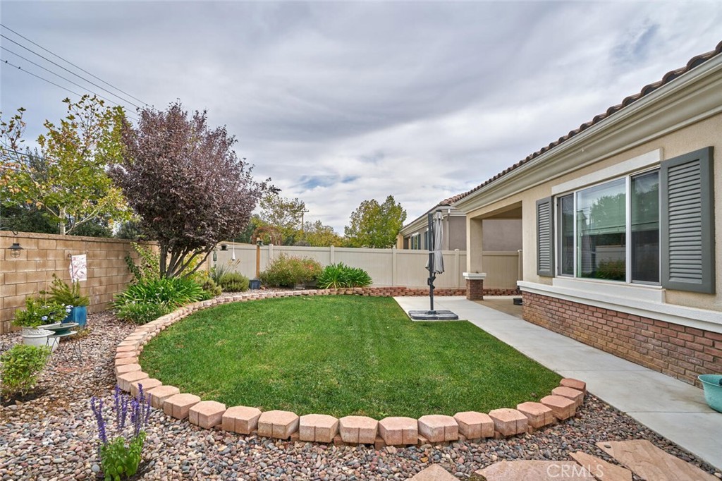 860 Annandale Road Beaumont, CA 92223 - Photo 36 of 61 a view of a backyard with a garden and plants