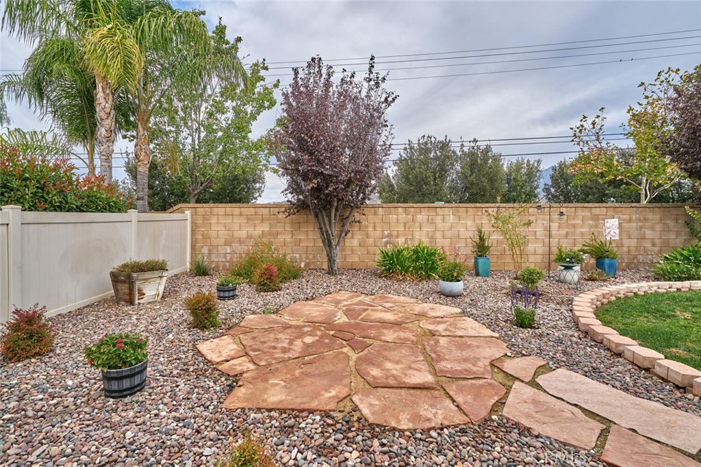860 Annandale Road Beaumont, CA 92223 - Photo 40 of 61 a view of a backyard with plants and lake