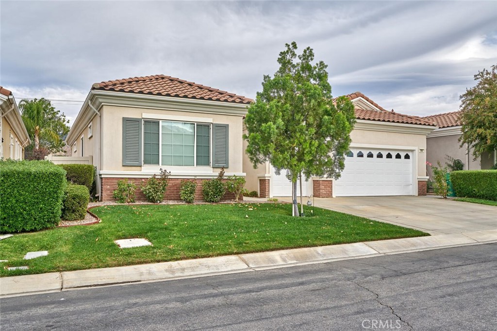 860 Annandale Road Beaumont, CA 92223 - Photo 4 of 61 a front view of a house with a yard and garage
