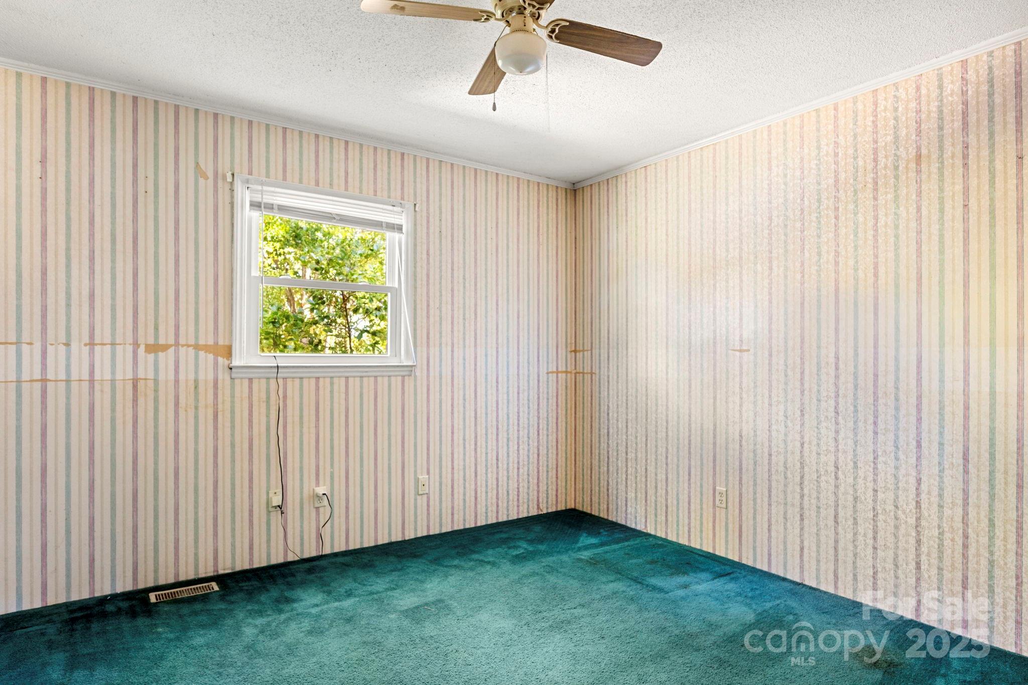 543 Blacksnake Road Stanley, NC 28164 - Photo 11 of 19 a view of an empty room with a window