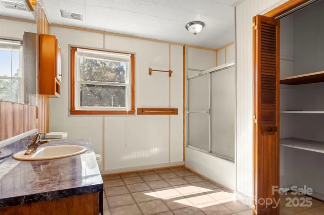 a view of entryway with brick walls