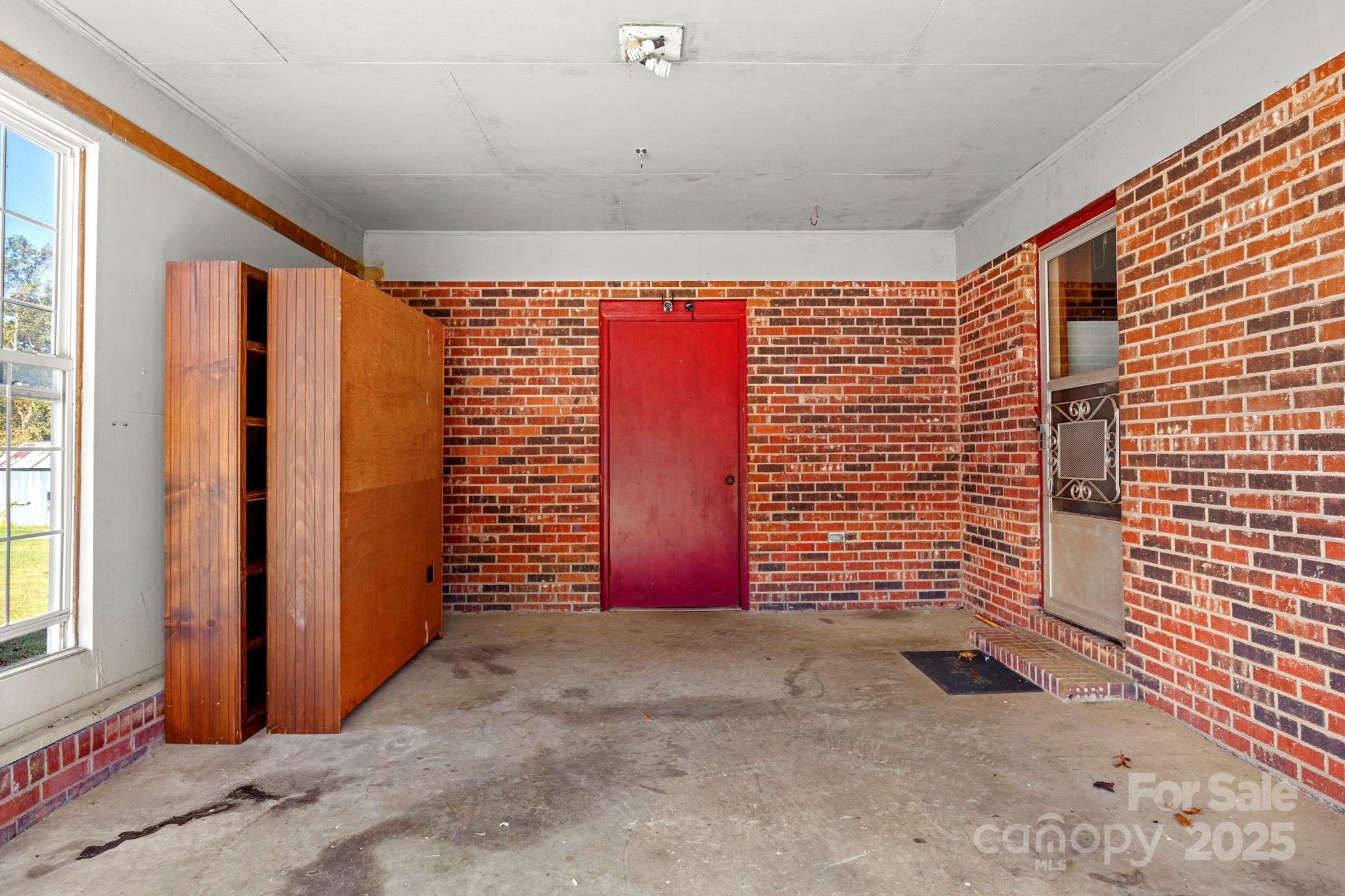543 Blacksnake Road Stanley, NC 28164 - Photo 16 of 19 a view of entryway with brick walls
