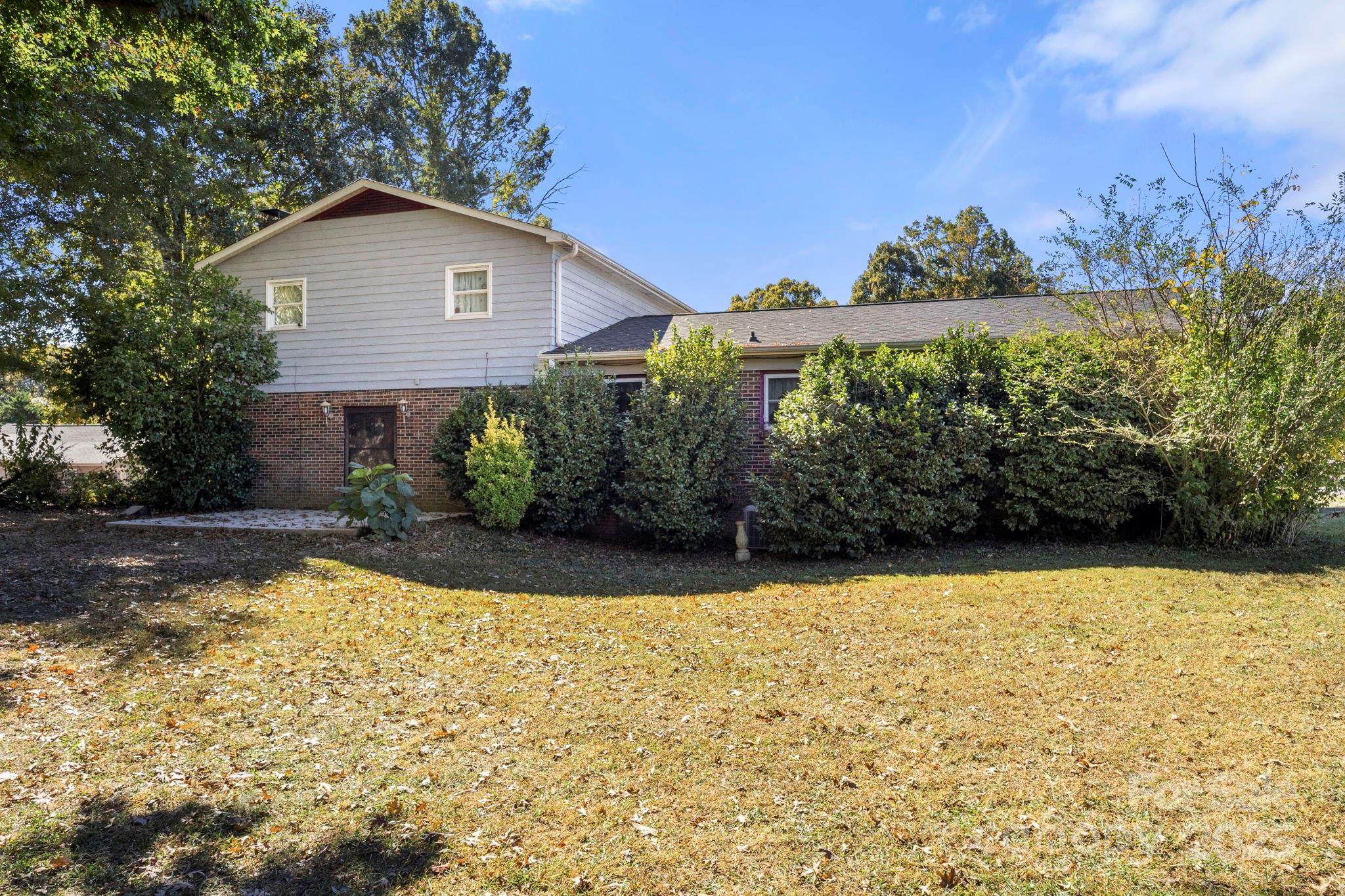 543 Blacksnake Road Stanley, NC 28164 - Photo 19 of 19 a view of a house with a yard