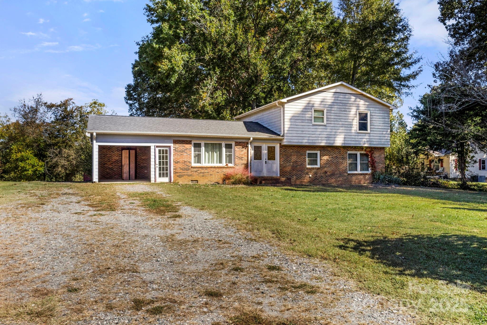 543 Blacksnake Road Stanley, NC 28164 - Photo 2 of 19 a front view of a house with a yard