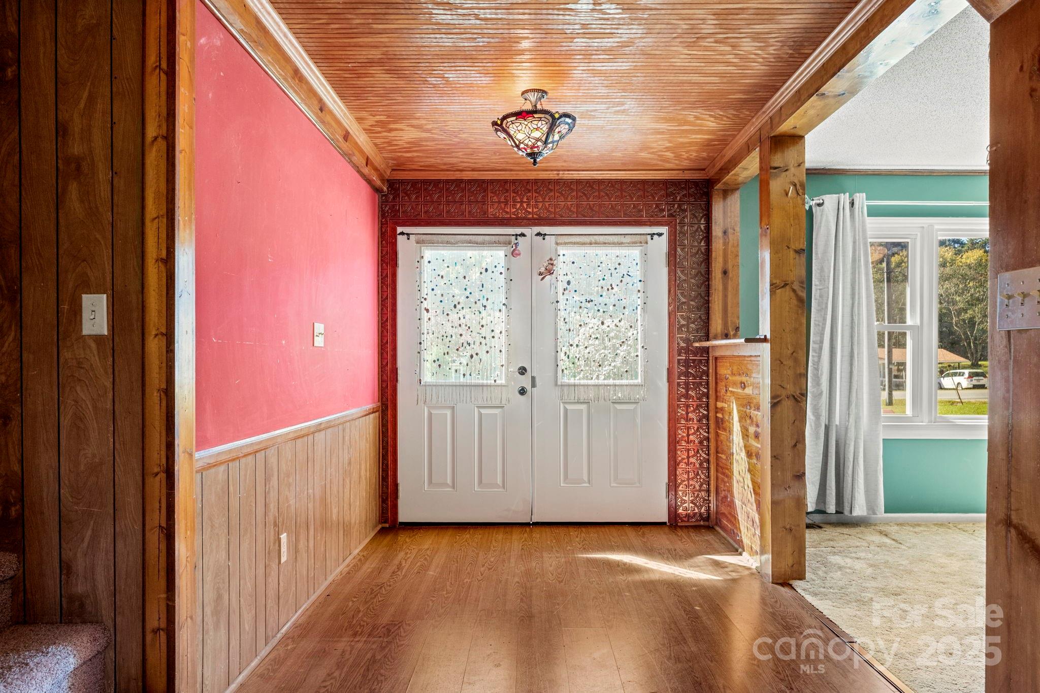 543 Blacksnake Road Stanley, NC 28164 - Photo 3 of 19 a view of a hallway with a window