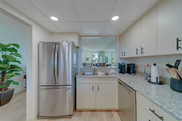 a kitchen with a sink stove and microwave