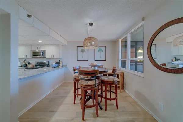 a dining room with furniture and window