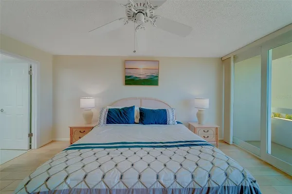 a bedroom with two beds and painting on the wall