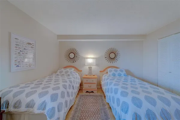 a bathroom with a sink a toilet a mirror and shower