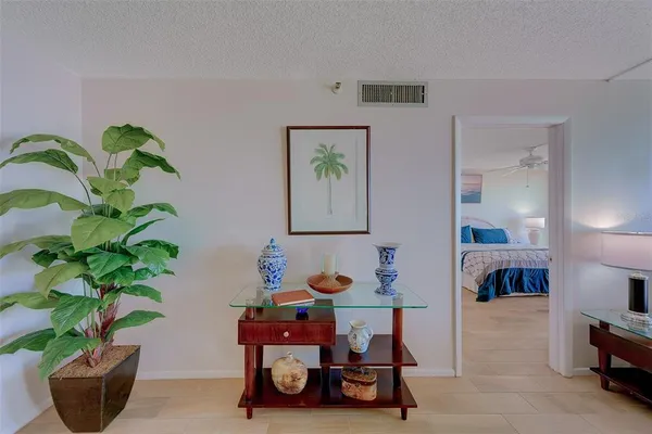a view of swimming pool with a garden and plants