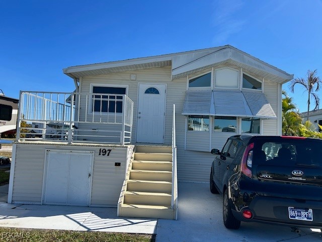 a front view of a house with stairs