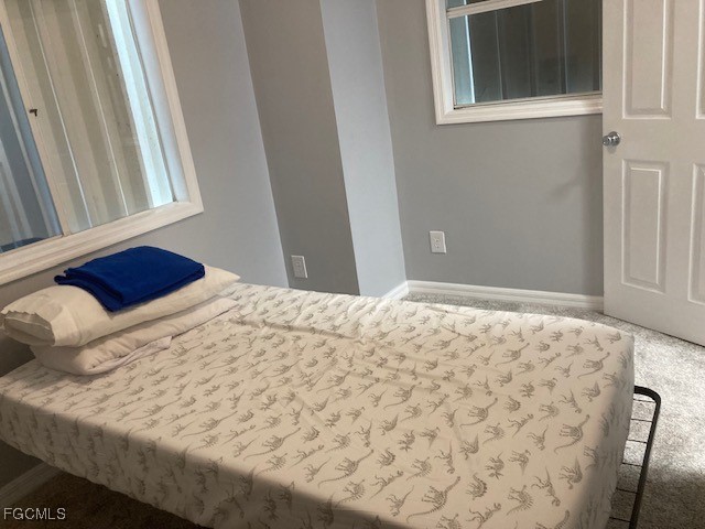19681 Summerlin Road, Unit J197 Fort Myers, FL 33908 - Photo 11 of 22 a bedroom with a bed and a window