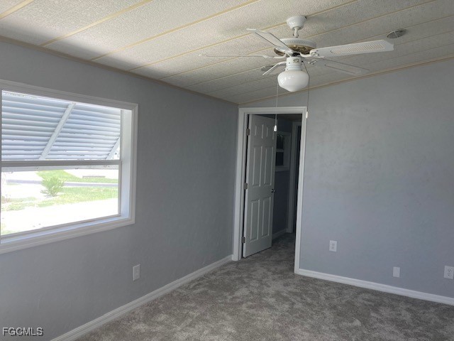 19681 Summerlin Road, Unit J197 Fort Myers, FL 33908 - Photo 17 of 22 an empty room with windows and fan
