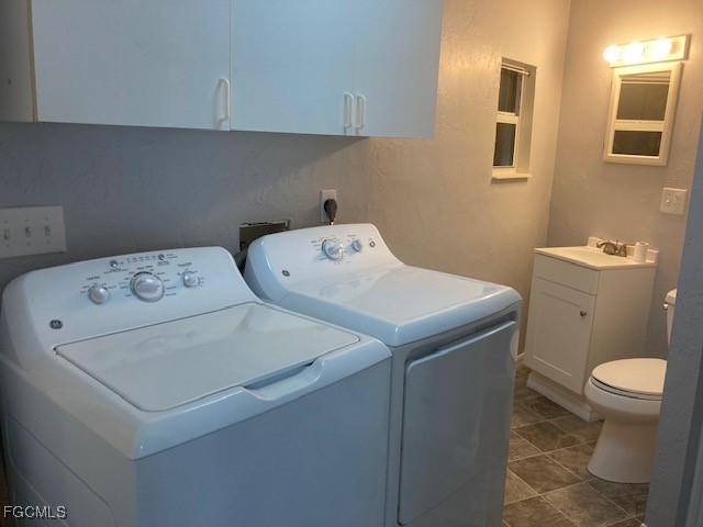 19681 Summerlin Road, Unit J197 Fort Myers, FL 33908 - Photo 20 of 22 a utility room with dryer and washer