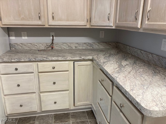 19681 Summerlin Road, Unit J197 Fort Myers, FL 33908 - Photo 4 of 22 a kitchen with granite countertop cabinets and window