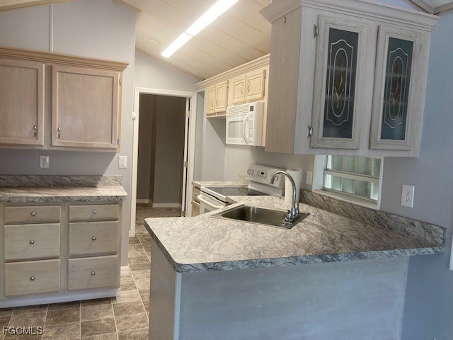 19681 Summerlin Road, Unit J197 Fort Myers, FL 33908 - Photo 5 of 22 a kitchen with granite countertop a sink and cabinets