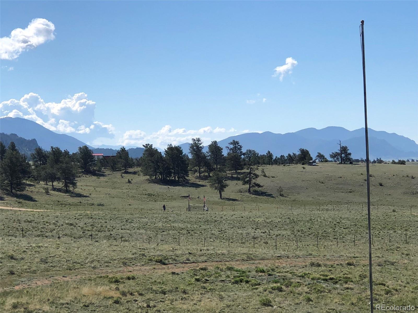 1983 Arapahoe Road Hartsel, CO 80449 - Photo 37 of 39 a view of a dry yard with mountains