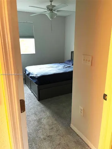 a room with a bed and painted walls