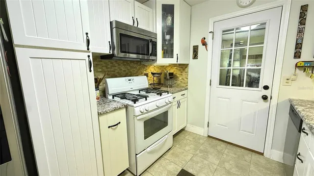 a kitchen with a stove and a microwave