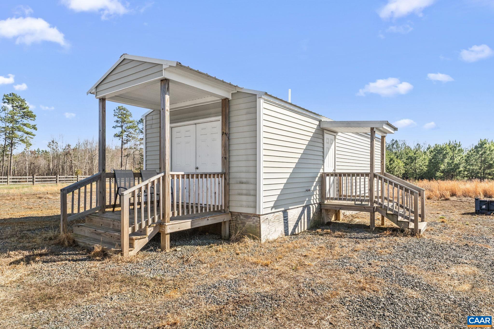 12145 South Constitution Route Scottsville, VA 24590 - Photo 16 of 22 a view of a house with a yard and wooden fence
