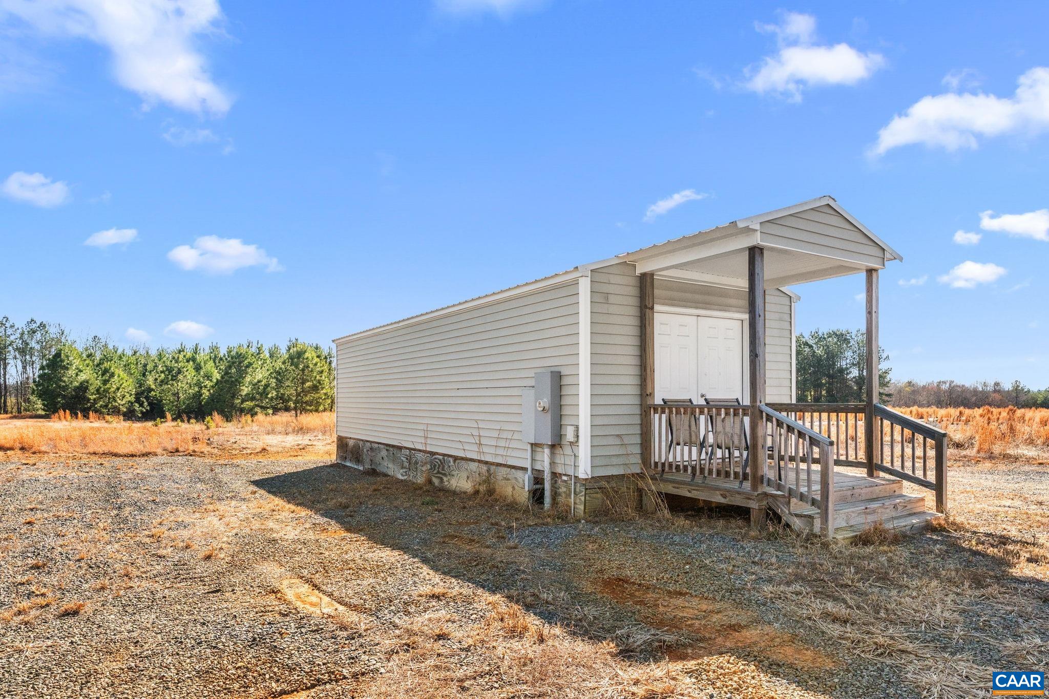 12145 South Constitution Route Scottsville, VA 24590 - Photo 17 of 22 a backyard of a house with table and chairs
