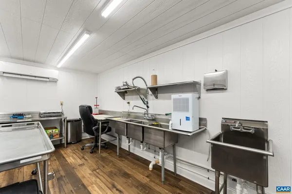 a kitchen with lots of counter top space and stainless steel appliances