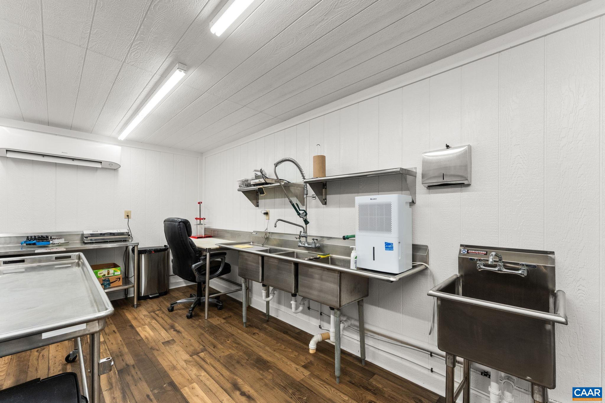 12145 South Constitution Route Scottsville, VA 24590 - Photo 19 of 22 a view of a workspace with furniture