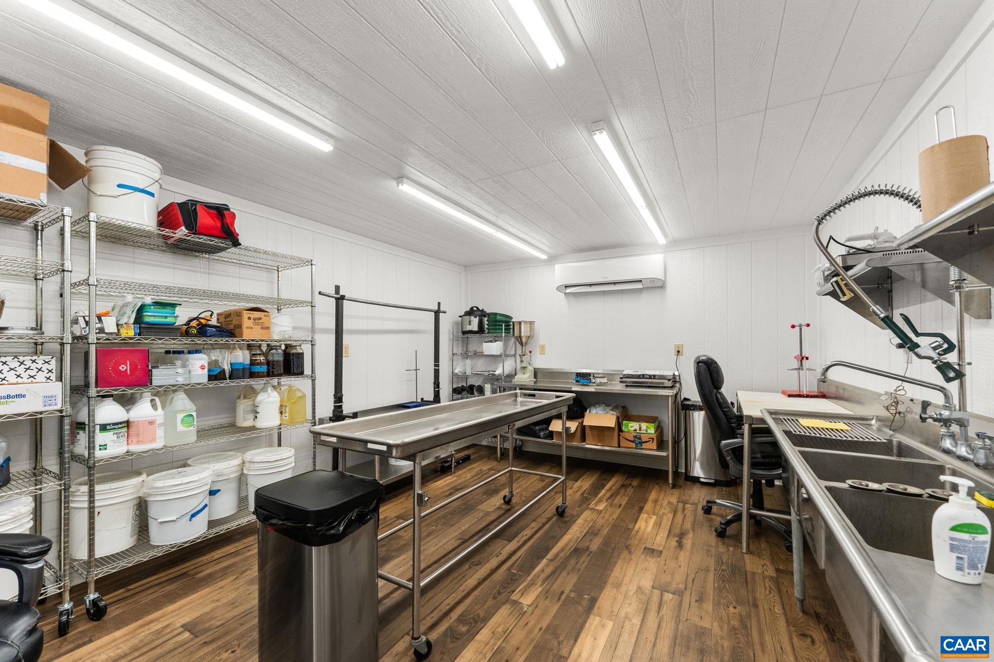 12145 South Constitution Route Scottsville, VA 24590 - Photo 20 of 22 a kitchen with lots of counter top space and stainless steel appliances