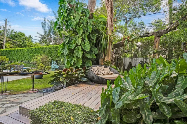 a living room with furniture a window and a fireplace