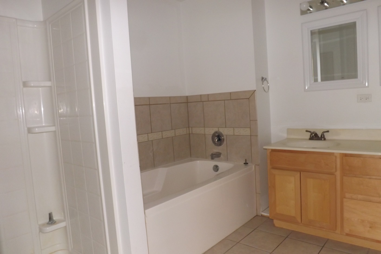 1237 Georgetown Way Vernon Hills, IL 60061 - Photo 11 of 16 a white bath tub sitting next to a white sink