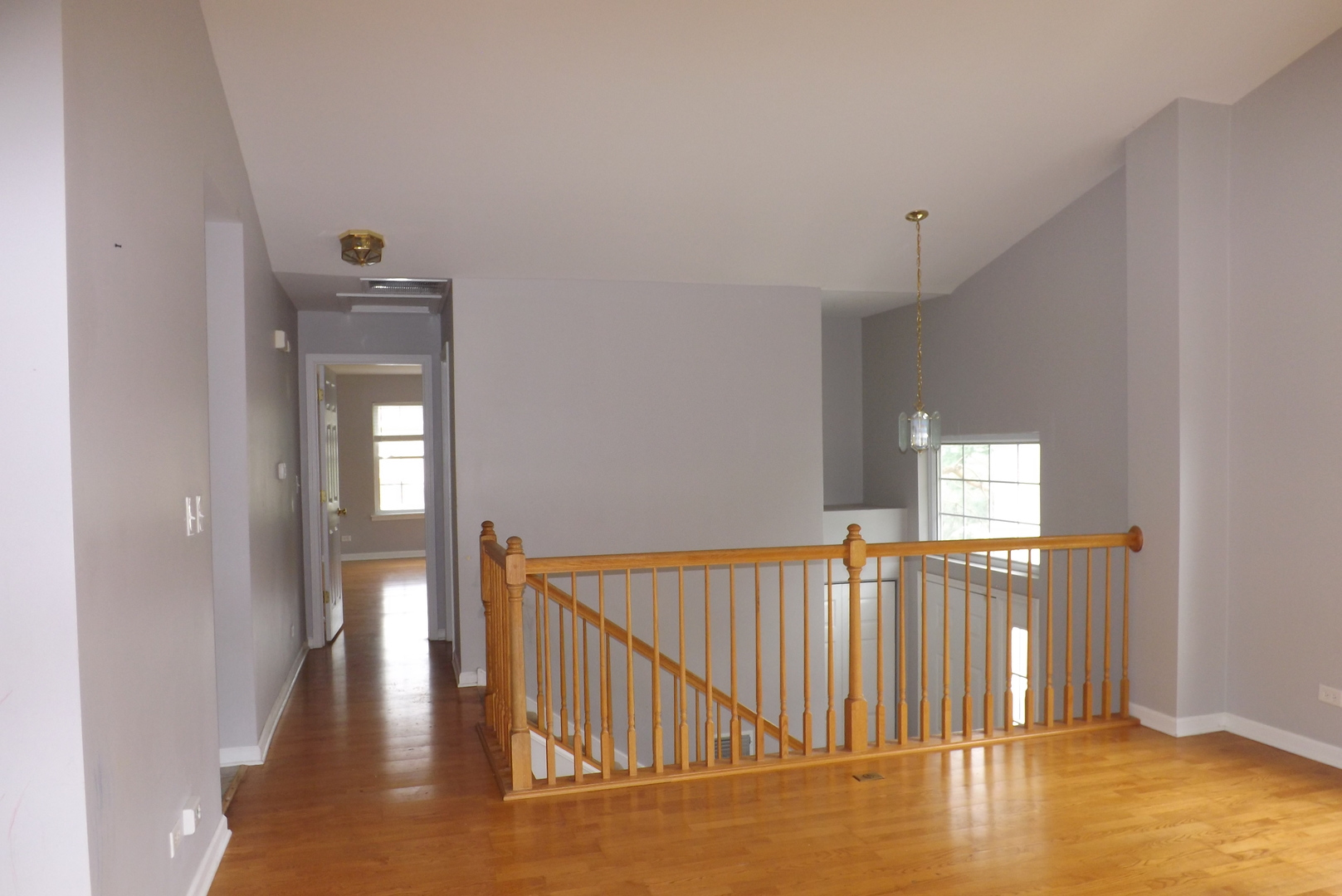 1237 Georgetown Way Vernon Hills, IL 60061 - Photo 4 of 16 a view of a hallway with wooden floor and staircase