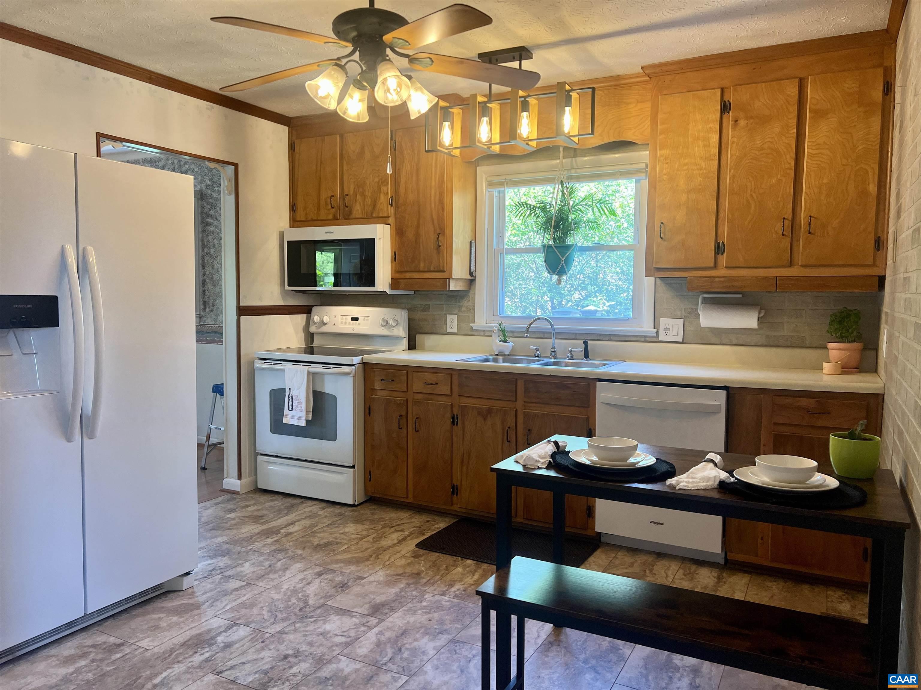 141 Quick's Mill Road Verona, VA 24482 - Photo 35 of 70 a kitchen with a sink cabinets and window