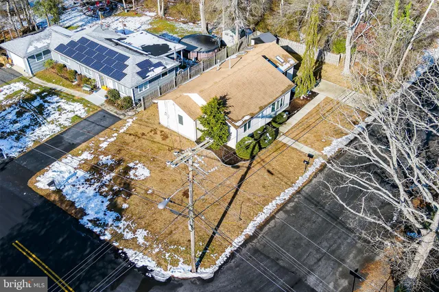 a view of a backyard with sitting area