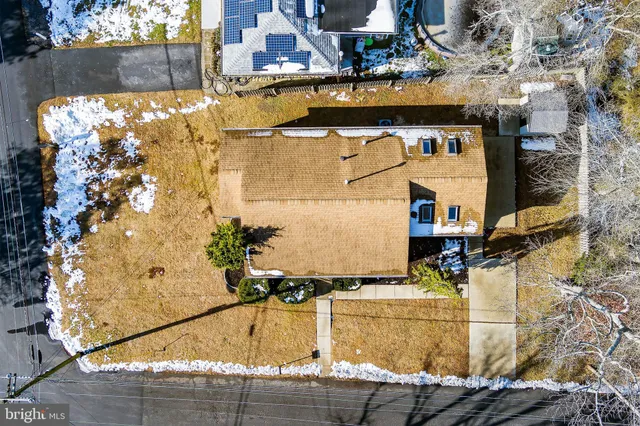 an aerial view of a house with a swimming pool