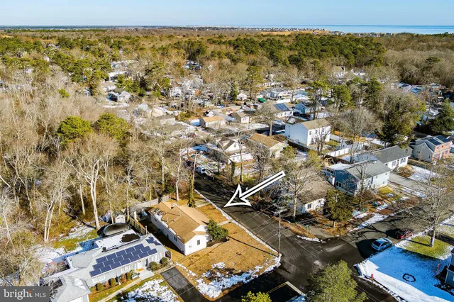 an aerial view of a house with a ocean view
