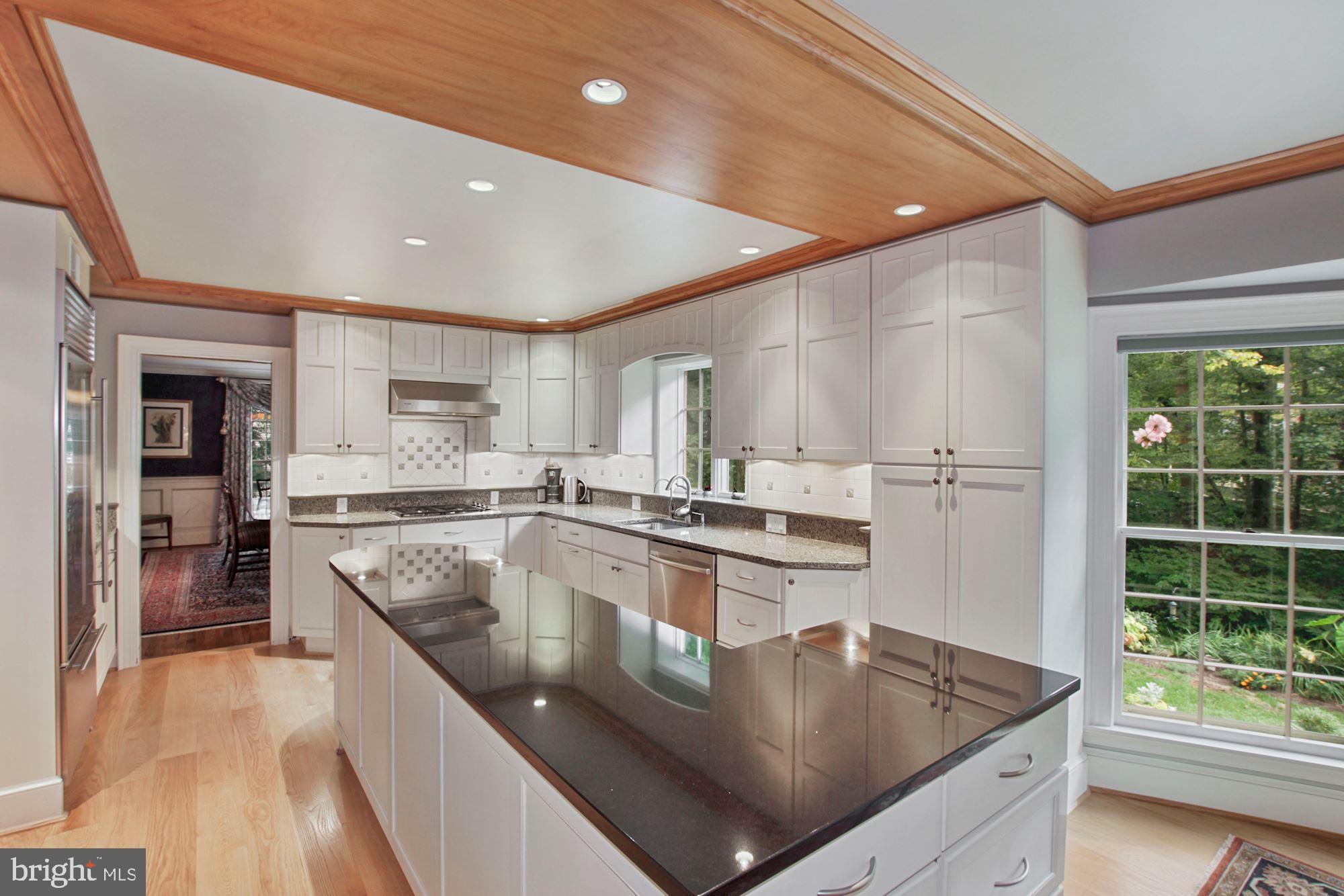 9409 Brooke Drive Bethesda, MD 20817 - Photo 17 of 47 Gourmet kitchen with cherry wood detailing