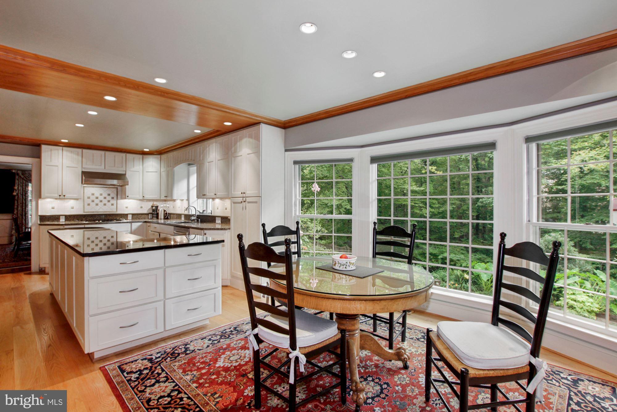 9409 Brooke Drive Bethesda, MD 20817 - Photo 20 of 47 Breakfast area off kitchen overlooking grounds